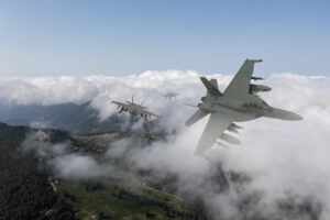 Jet fighters flying over the clouds.
