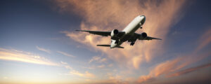 Boeing 777 coming in to land from bright twilight sky. More aircraft here.
