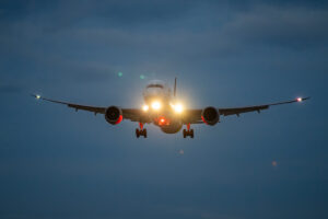 Commercial Airliner piercing through the dusk sky