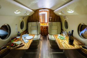 A private jet interior with warm wood accents and sleek design