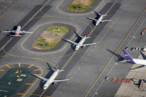 An aerial view of planes taxiing at Boston Airport | Photo: Wirestock