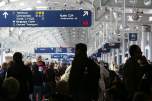 Passengers walking through airport concourse in O'Hare