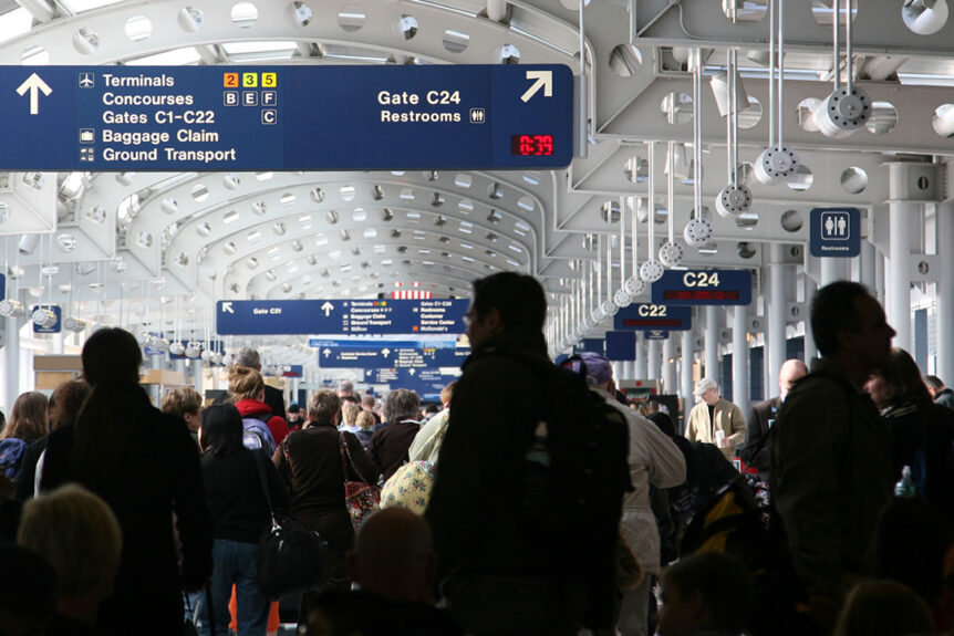 Passengers walking through airport concourse in O'Hare