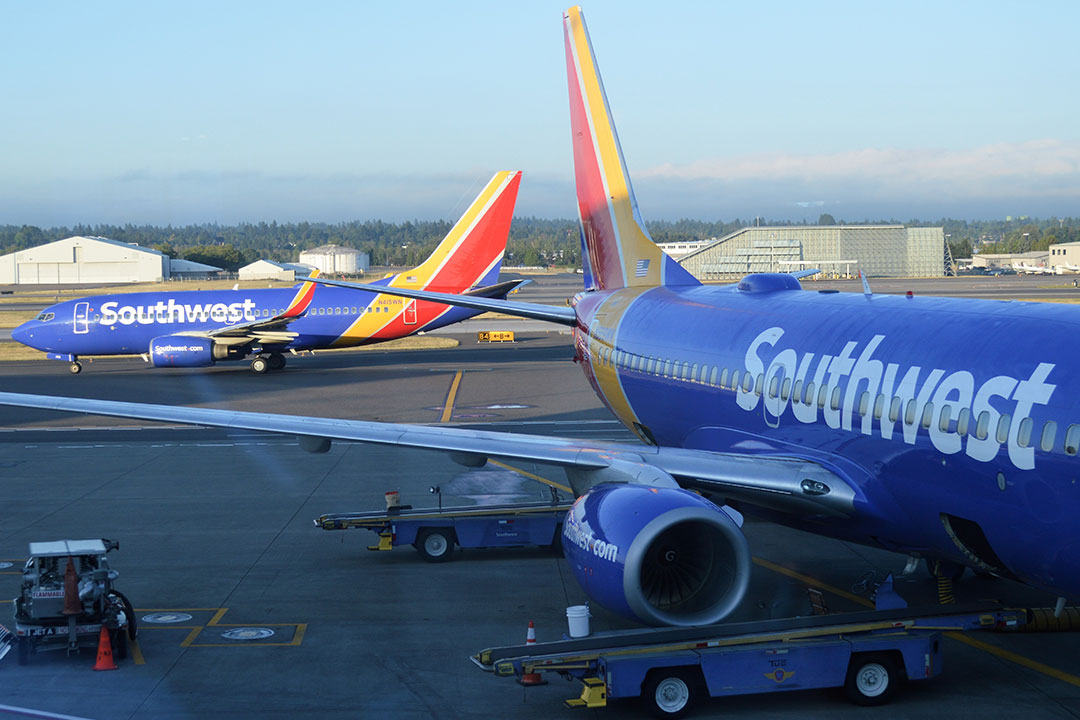 Southwest airlines passenger planes at terminal at Portland International Airport (PDX) | Photo: Around the World Photos / Shutterstock.com