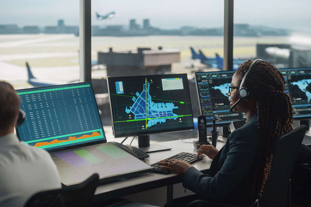 Air Traffic Controller with Headset Talk on a Call in Airport Tower.