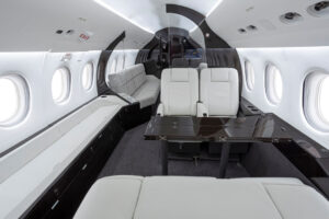 A new credenza and eye catching center dividers create a dramatic, modern style in this refurbished Falcon 900EX cabin. | Photo: duncanaviation.aero