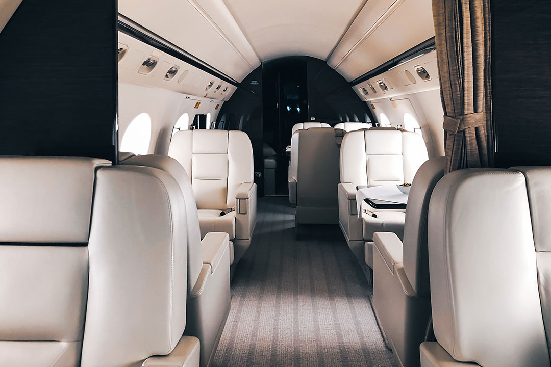 The calm and orderly cabin of a private jet, prepared for departure.