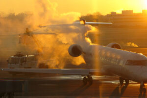 Private jet aircraft getting sprayed with de icing fluid