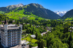 aerial view of Gstaad in Switzerland, showcasing the famous Gstaad Palace