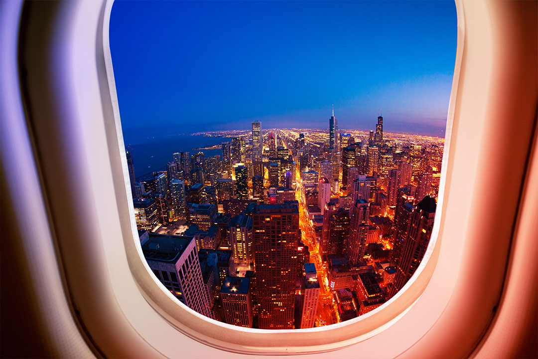 Aerial view of Chicago, IL from the window of a private jet.