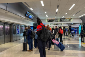 People waiting for the plane train to be transported to an airport gate at Hartsfield Airport | Photo: Joni Hanebutt
